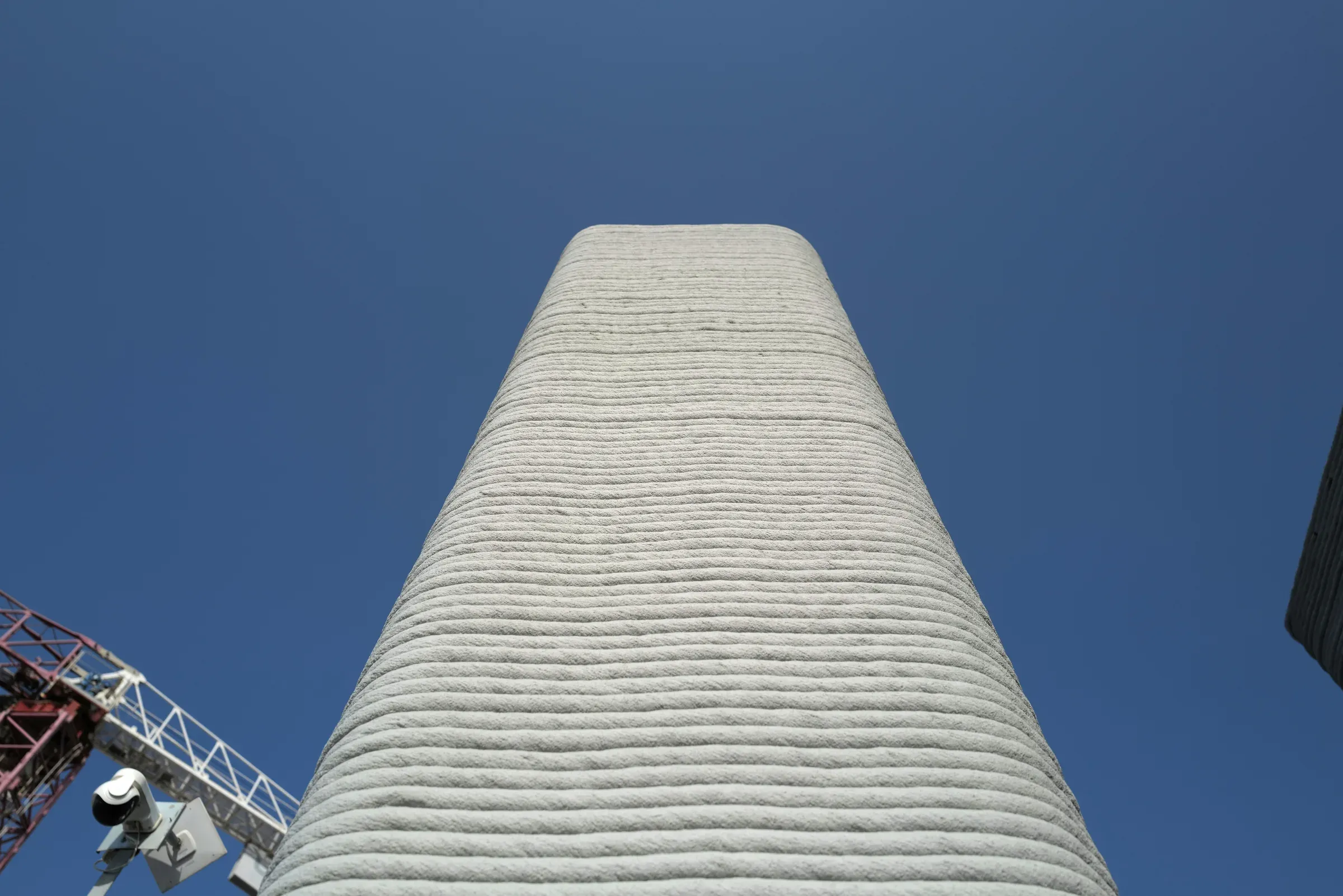 3D printed concrete column against the sky, School 08, Doha
