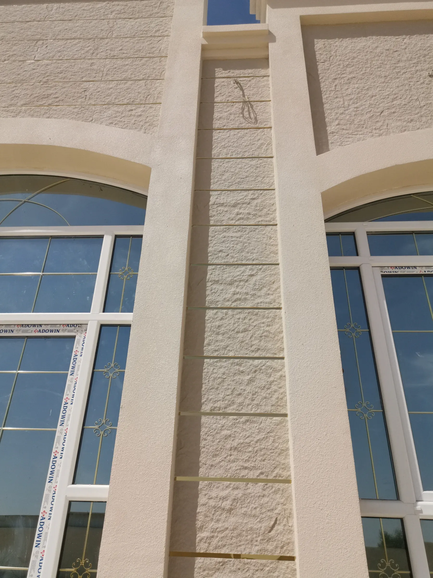 Villa and majlis · Al Shahaniya · grooved and textured AAC façade