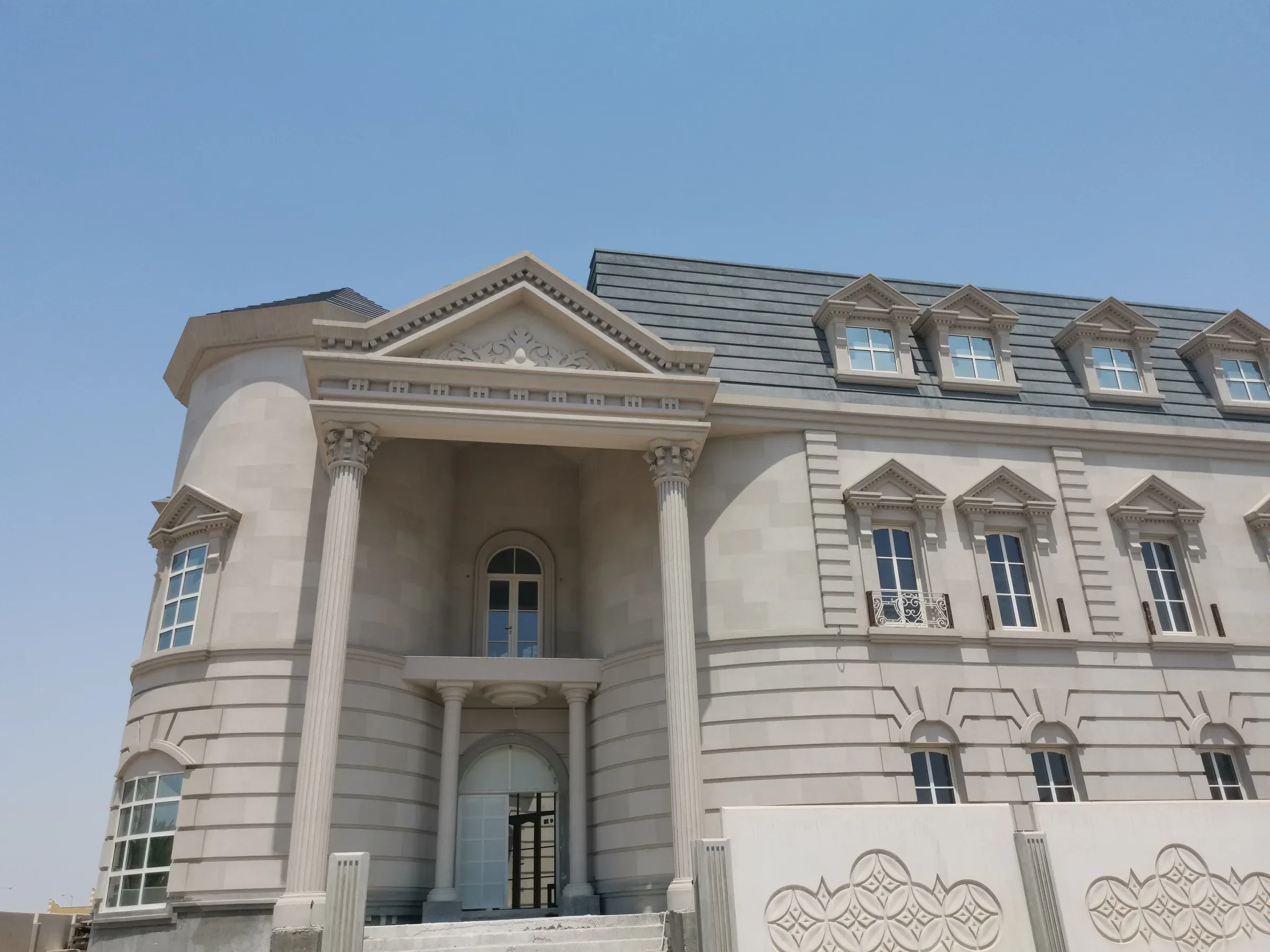 Classical façade over AAC · villa, Doha