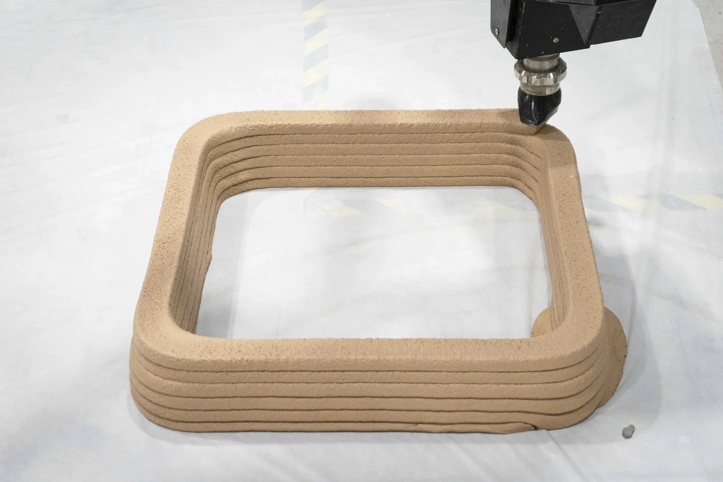 Nozzle printing a test ring during operator training